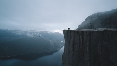 Captivating 1080p HD Wallpaper Majestic Landscape of Preikestolen in Norway with Mountains Snow Mist and Cliff