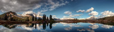 Green Leafed Trees A Stunning HD Wallpaper of Nature Reflections and Mountains