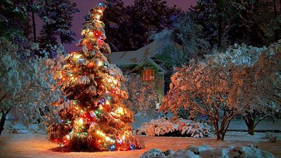 Snowy Christmas Night HD Wallpaper with Christmas Lights and Festive Decorations