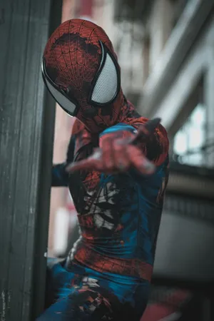 SpiderMan in Action HD Cosplay Wallpaper Showcasing Urban Superhero Vibes and Athletic Determination